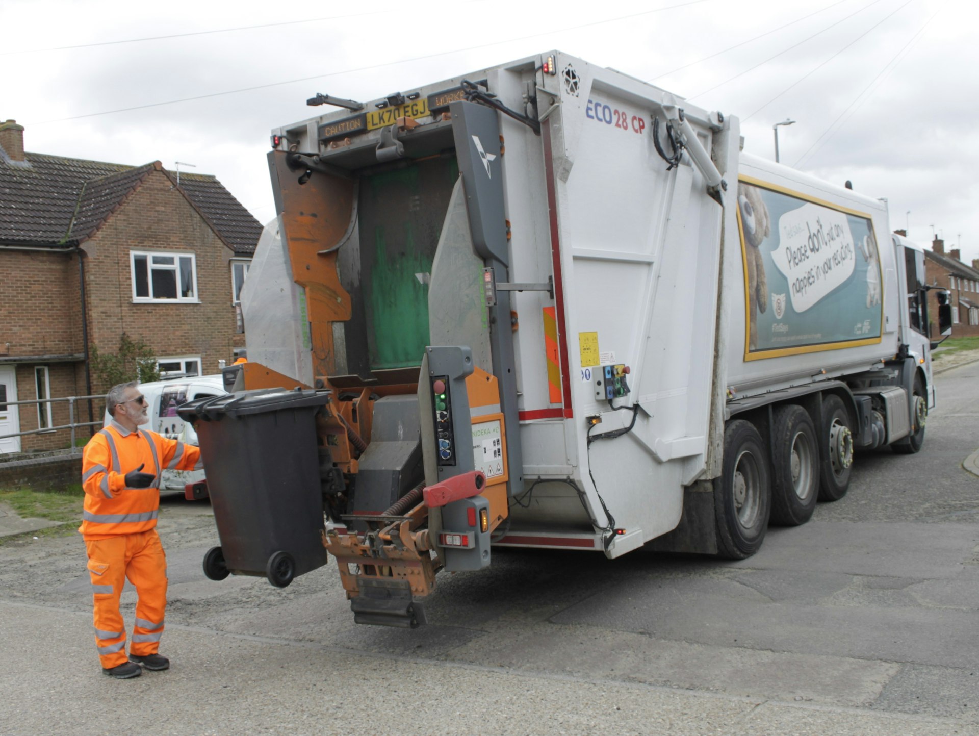 Black bins being collected